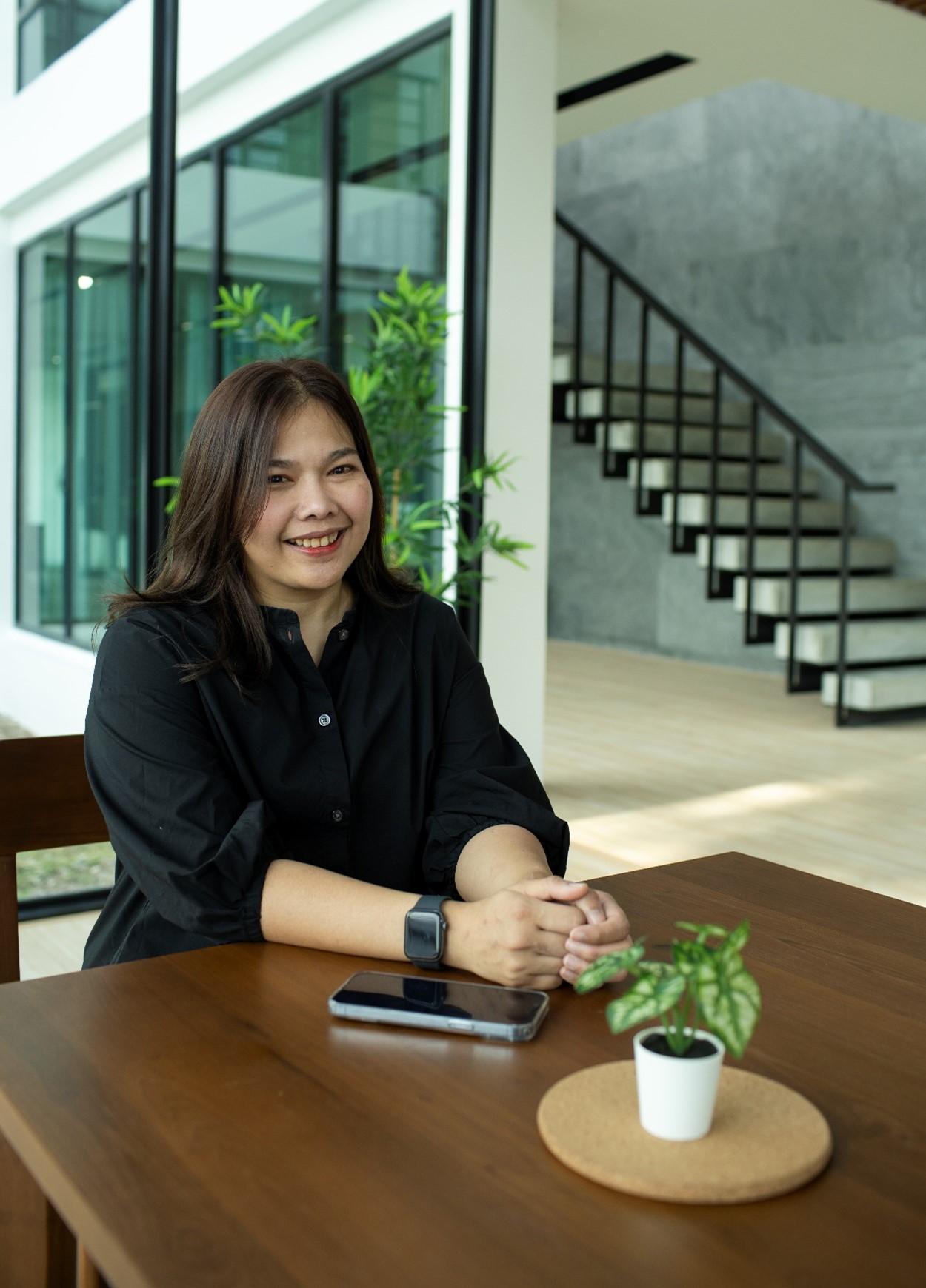 Woman with type 2 diabetes smiling in a living room